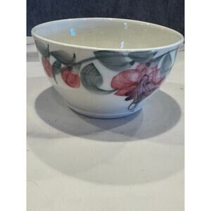 handcrafted ceramic bowl featuring a painted floral motif - bleeding heart